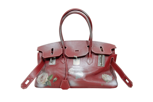 Vintage Italian red leather east west handbag with turn lock closure and floral motif