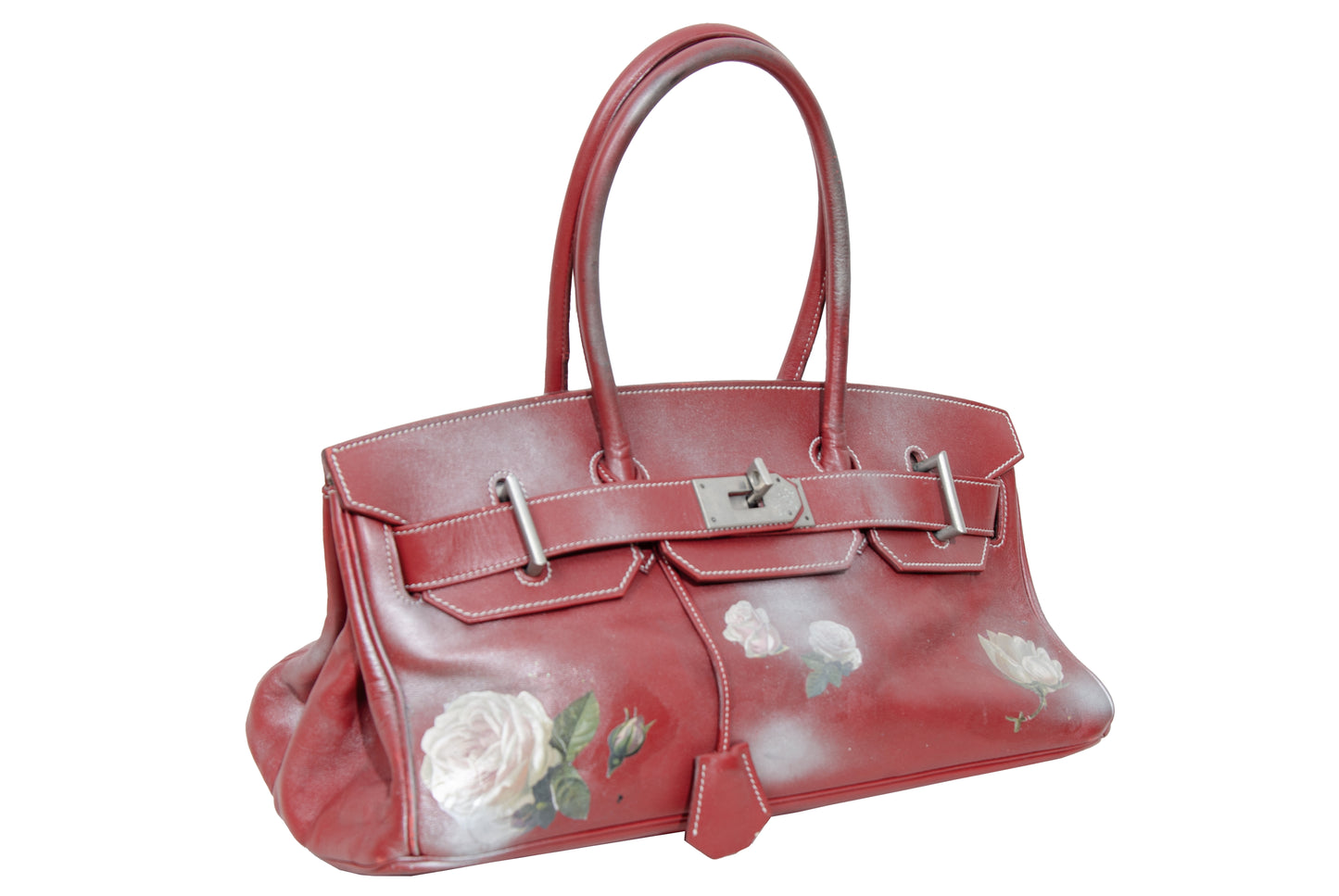 Vintage Italian red leather east west handbag with turn lock closure and floral motif