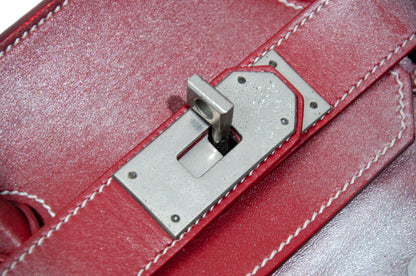 Vintage Italian red leather east west handbag with turn lock closure and floral motif