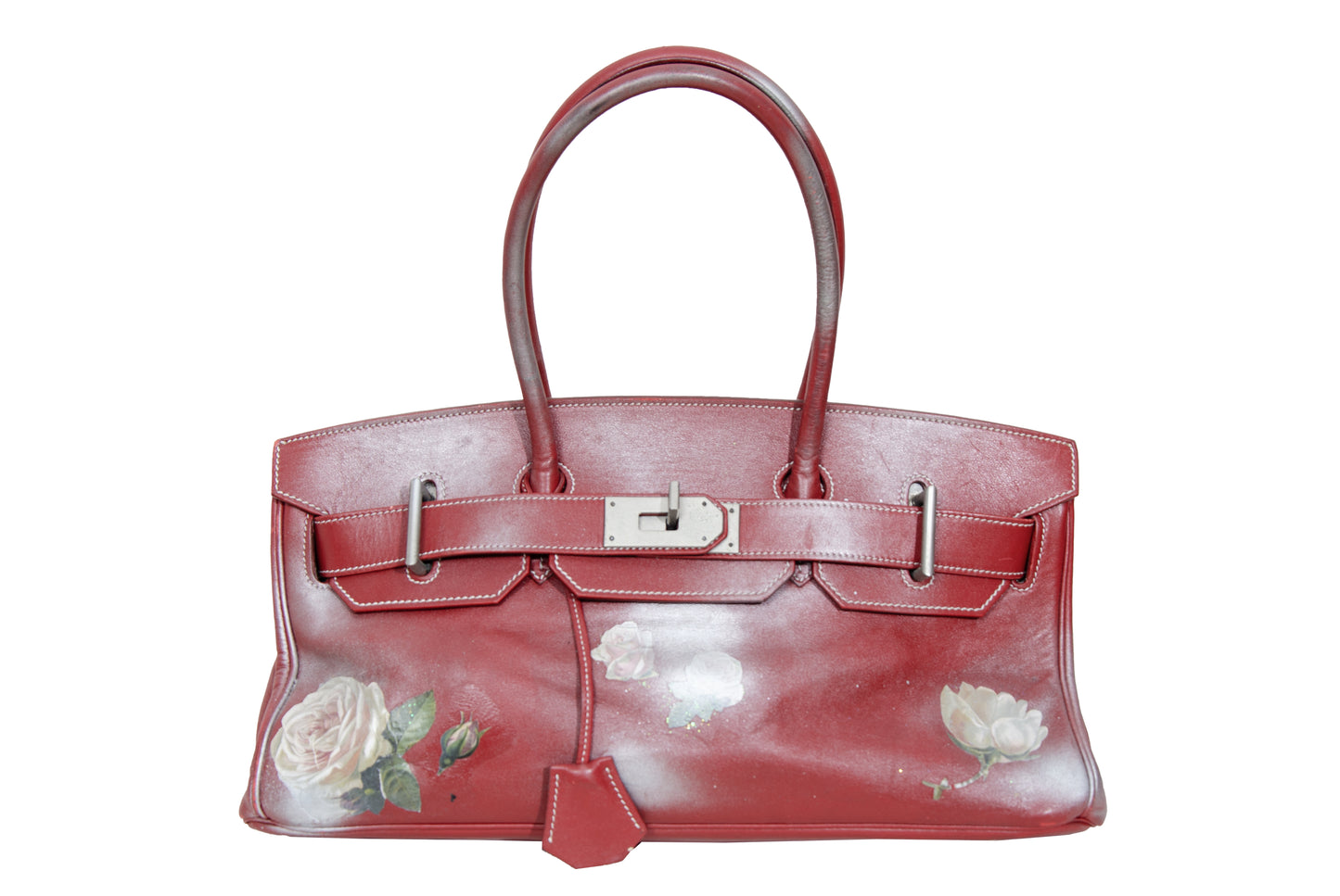 Vintage Italian red leather east west handbag with turn lock closure and floral motif