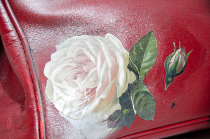 Vintage Italian red leather east west handbag with turn lock closure and floral motif