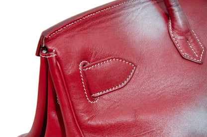 Vintage Italian red leather east west handbag with turn lock closure and floral motif