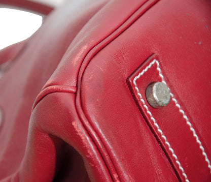 Vintage Italian red leather east west handbag with turn lock closure and floral motif